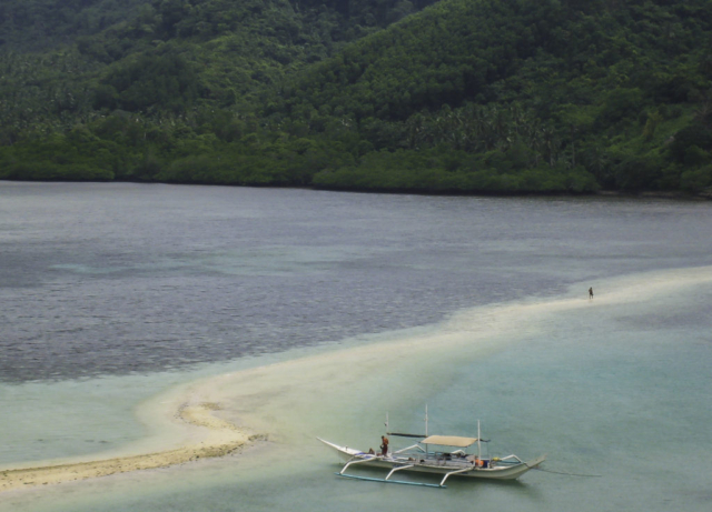 A boat on a sandbank near El Nido in the Philippines